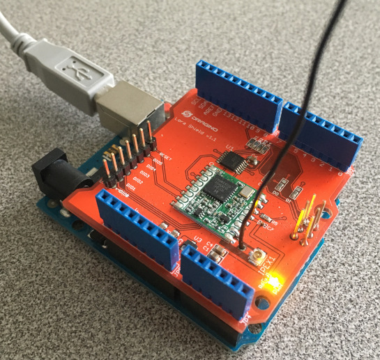 Attach the USB cable to Dragino LoRa shield and Arduino Uno