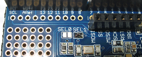 Solder the copper pads at SEL1